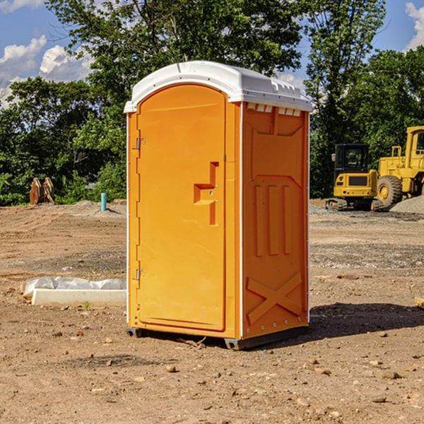 what is the cost difference between standard and deluxe portable restroom rentals in Emma